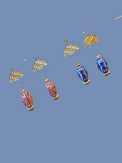 Statement Modern Design Golden Stud Earrings with Hand Painted Ceramic Ancient Character of Long-Life Beads